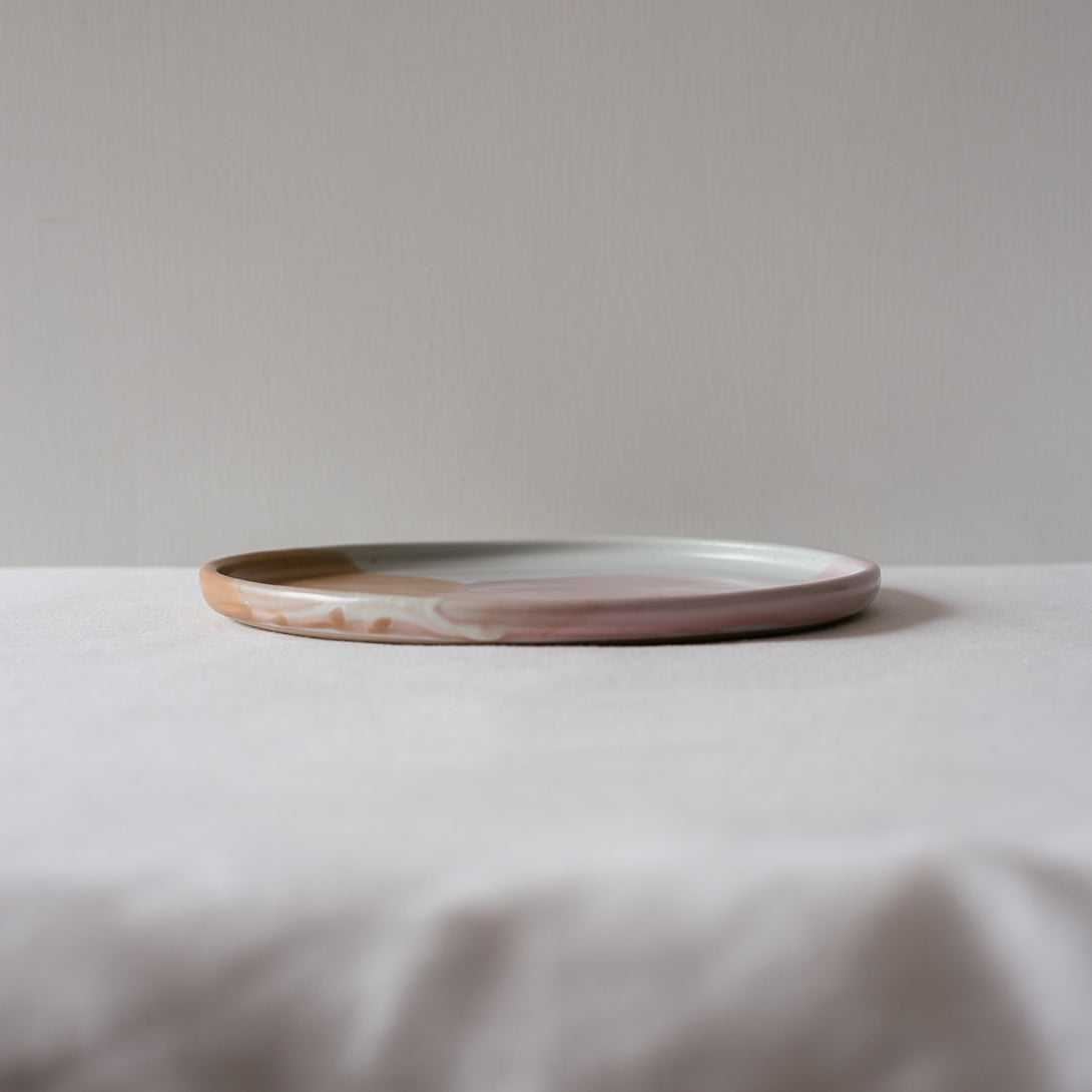 Handmade dinner plate with contemporary raised lip, detailed photo showing drippy glaze