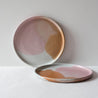 Two colourful dinner plates by Palinopsia Ceramics