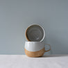 Two handmade mugs and cups in blue, brown and grey by Palinopsia Ceramics