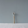 A single handmade ceramic teaspoon by Palinopsia Ceramics 