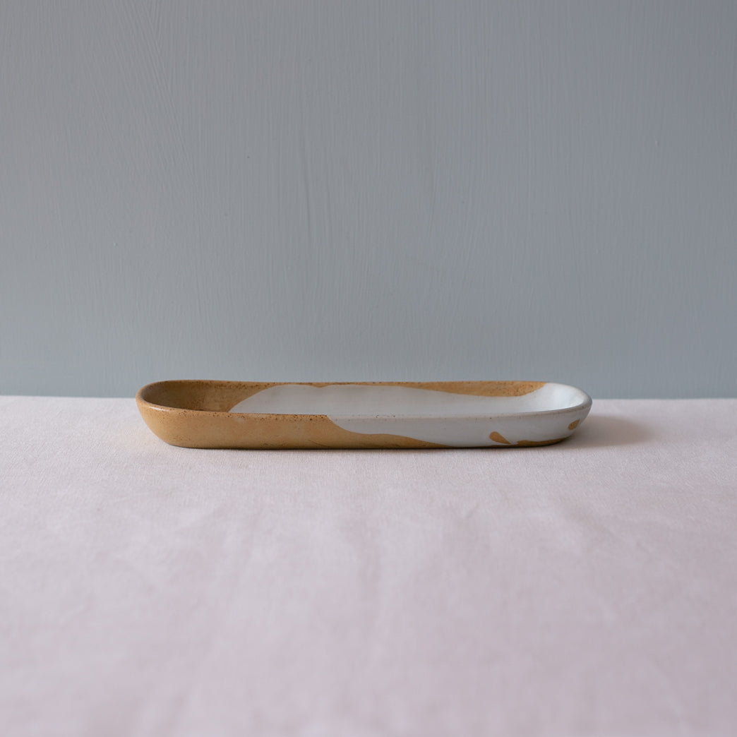 Side view of a mezze rectangle plate in blue and brown by Palinopsia Ceramics