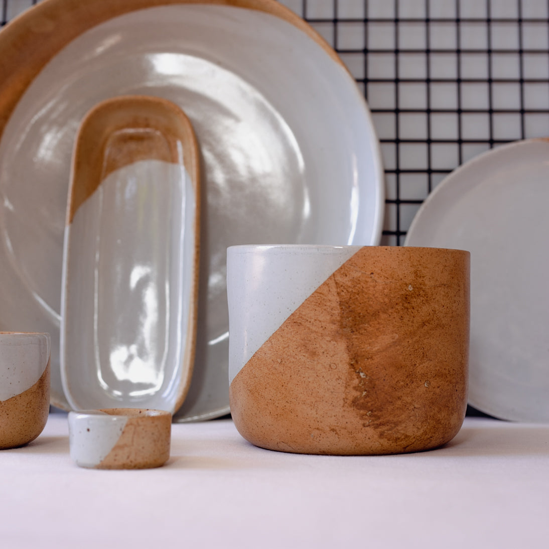 Handmade retro dinnerware in browns and blue greys
