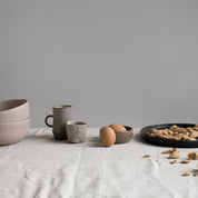 Palinopsia Dinner table with natural linen, handmade ceramics and in a still life inspired setting. 