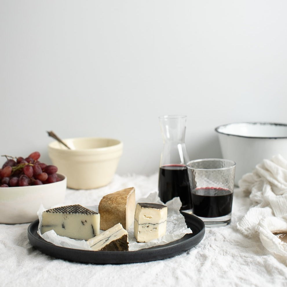 Handmade stoneware cheese plate in black by Palinopsia Ceramics in Sydney Australia 
