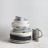 Handmade stacked dinner plates and bowls by Palinopsia Ceramics Australia