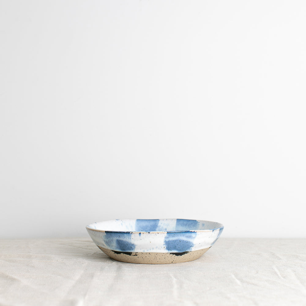 Palinopsia Ceramics handmade blue and white pasta bowl against white  linen backdrop