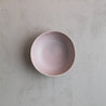 Birdseye view of a handmade soup bowl by Palinopsia Ceramics in a neutral pink and mushroom grey colour