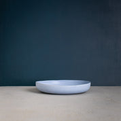 Powder blue pasta bowl showing it's organic shape, handmade by Palinopsia Ceramics 