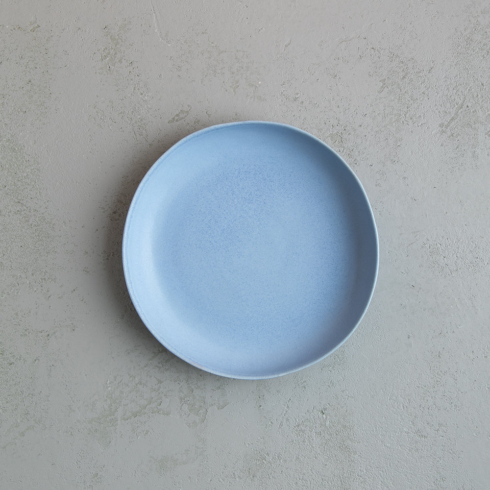 Birdseye view of Palinopsia Ceramics Shallow powder blue handmade pasta bowl for entree and pasta dishes from their Sabe Dinner set collection 