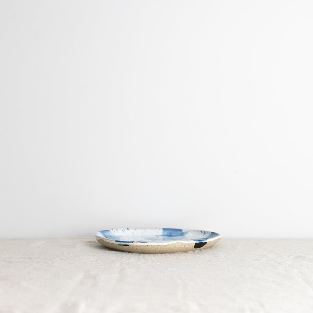 Side view of a handmade Pollock lunch plate 