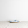 Side view of a handmade lunch plate by Palinopsia Ceramics in a blue and white design