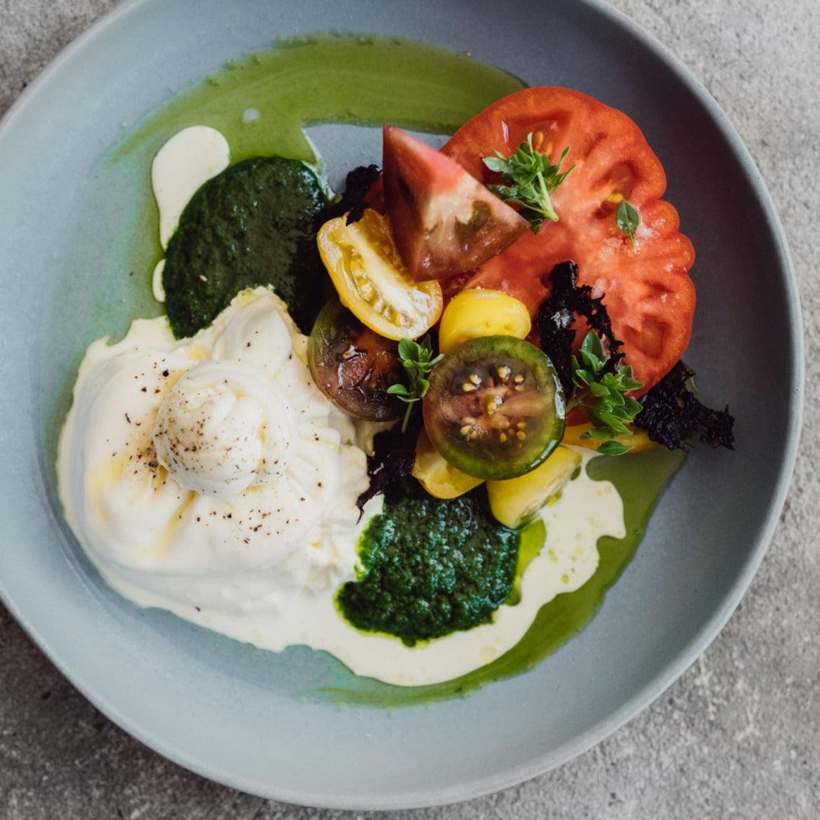 Caprese Salad served up on a powder blue handmade pasta and entree plate by Palinopsia Ceramics 