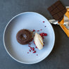 Chocolate pudding on a handmade brilliant blue bowl by Sydney Chef Gerald Touchard