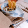 breakfast table setting with caramel napkin fresh fruit cereal dinnerware set