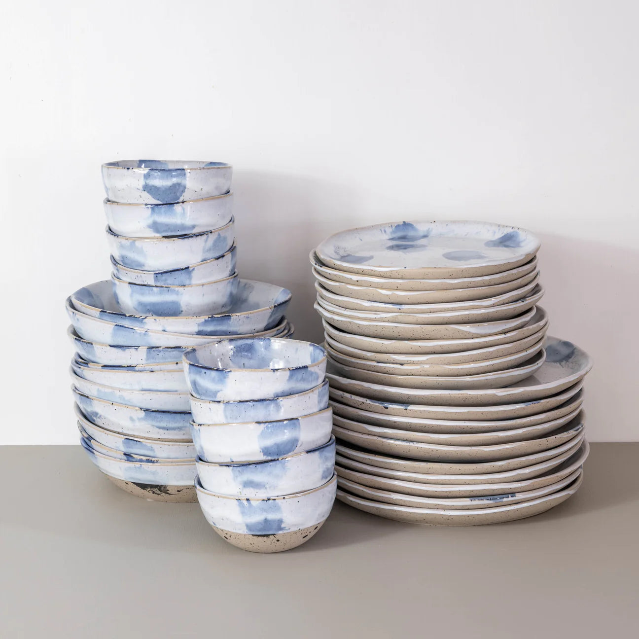 Handmade dinner set in blue and white for 10 people by Palinopsia Ceramics  