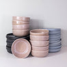 Large stack of handmade dinner set for 10 people by Palinopsia Ceramics in Sydney Australia 